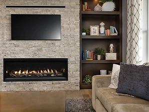 Astria Compass 55 linear gas fireplace with built-in shelving and stacked stone veneer