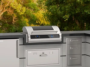 Fire Magic EL500i outdoor grill station with digital control panel in a stone countertop