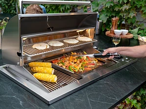 Fire Magic E540d stainless steel outdoor grill built into a stone countertop